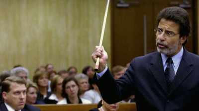 DAVID RUDOLF PULLS OUT
A LONG 4-FOOT OBJECT. - An American Murder Mystery: The Staircase