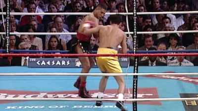 - De La Hoya trying
to throw a left hook, - The Golden Boy