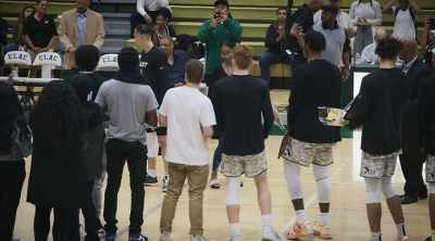 Deshaun is accompanied by Kiera Lusk. - Last Chance U: Basketball