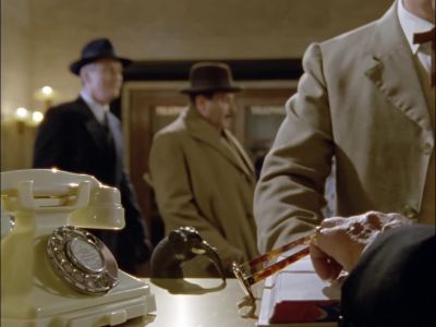 -[Desk Clerk]
Your key, Mr. Worthing. - Agatha Christie's Poirot