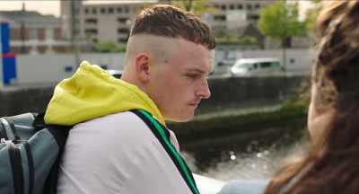 DISTANT CHEERING AND SHOUTING AND
WHISTLES BLOWING - The Young Offenders