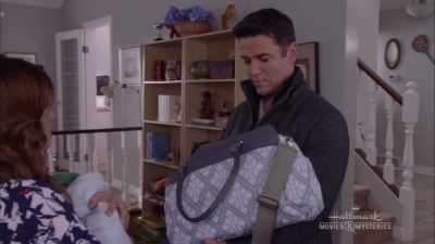 Do you mind getting a sleeper
out of the diaper bag, - A Bundle of Trouble: An Aurora Teagarden Mystery