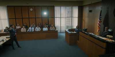 Do you see a man
being loaded into a Sheriff's vehicle? - The Lincoln Lawyer