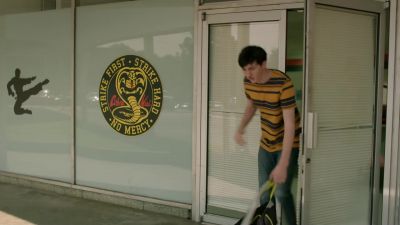 [DOOR BELL JINGLES] - Cobra Kai