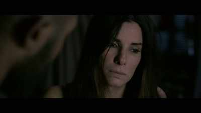 Down a small embankment,
you'll find a wall with a gate. - Bird Box