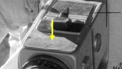 Dust sticks inexplicably
on cameras and lenses. - American Moon