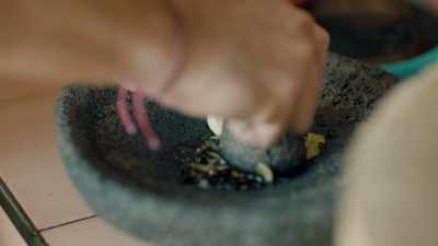 Enrique grinds
garlic, bay leaves, - Eva Longoria: Searching for Mexico
