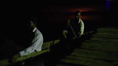 ESI: [narrating]
Another stranger visited us. - The Burial of Kojo