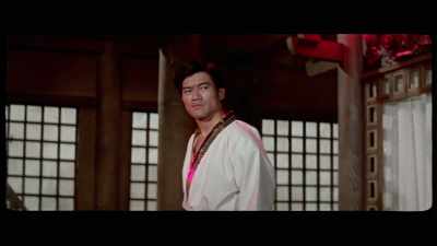 'Even Ji's choice to drench the room
with a harsh red light - The Final Game of Death