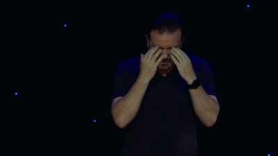"Everyone's looking." 
Pretending to be late, baseball cap. - Ricky Gervais: Humanity