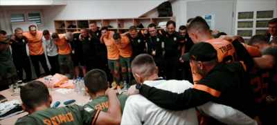 [fans chanting] - Football Must Go On