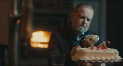 [fire crackling]
[gentle poignant music] - Christmas Cowboy