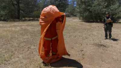 (fire shelter rustles open) - Fireboys