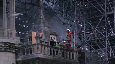 Firefighters put out the last embers. - Ancient Engineering