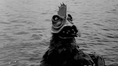 (Foreboding music drowning out beach band) - The Horror of Party Beach
