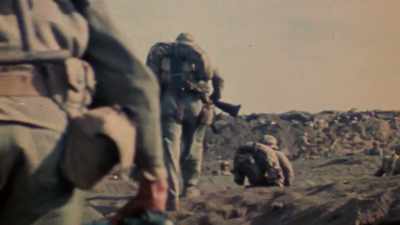 ... fresh troops come ashore
to reinforce depleted units. - The Pacific War in Color