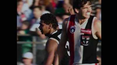 From 60 metres,
Nicky Winmar kicks. - The Australian Dream