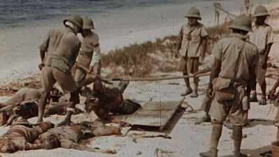 GATHER THEIR OWN WAR DEAD
FOR PIT BURIAL. - The Pacific War in Color