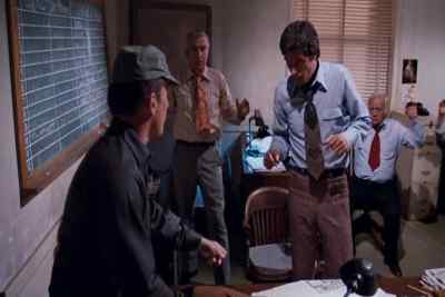 Get down on the floor,
both of you.  Face down. - The Outfit