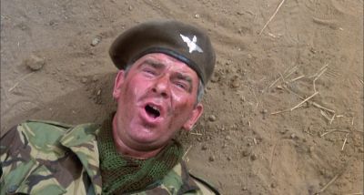Get on your feet you fucking abortion - The Wild Geese