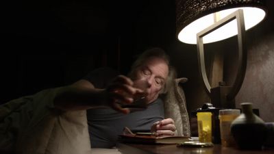 Gold comforter. Green chair. - Better Call Saul
