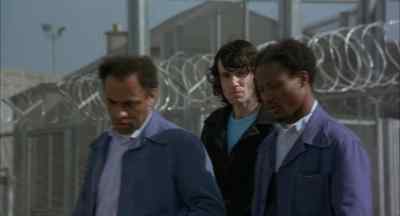 GUARD 1: Back to your cell now!
GUARD 2: Keep moving. - In the Name of the Father