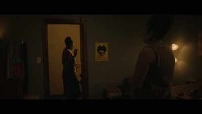 [guitar music plays]
[muffled conversations] - The Other Black Girl