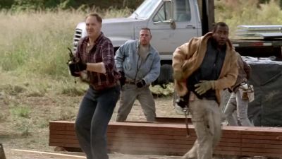 ( gunshots )
( woman echoes ) Roamers! - The Walking Dead