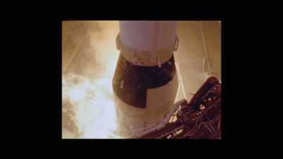 HARRISON (VO):
"The Saturn V was a 3,000-tonne machine - Armstrong