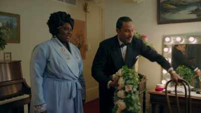 He alls himself "brother john"
and he sings - Robin Roberts Presents: Mahalia