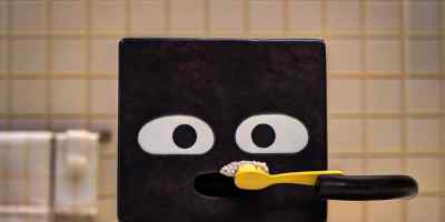 He brushes his teeth. - Shape Island