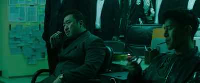 He calls his 70-year-old mother
everyday - The Gangster, the Cop, the Devil