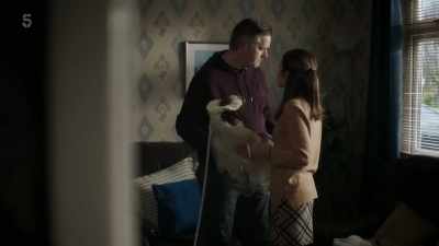 HE CHUCKLES SOFTLY - The House Across the Street