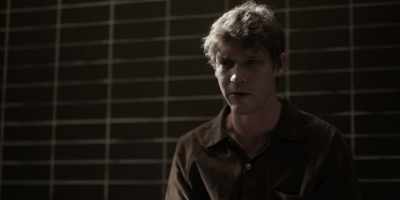 He had dark hair--brown. - Under the Banner of Heaven