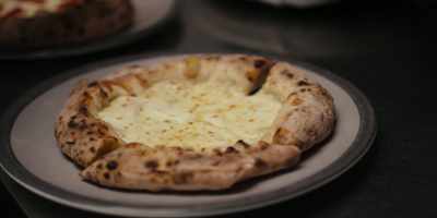 He doesn't have the tomato base.
He has the mozzarella base. - Chef's Table: Pizza