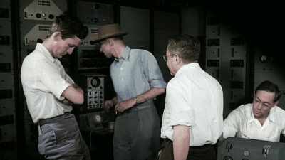 HE EVEN BETS A COLLEAGUE
TEN DOLLARS THAT IT WON'T WORK. - America in Color