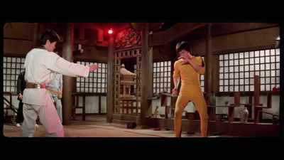 'He extends out one arm
to keep his distance, - The Final Game of Death