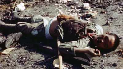 He films the horrors
that now litter Manila. - The Pacific War in Color