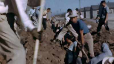 HE FILMS THE INTERNEES FORCED
TO CONSTRUCT THEIR OWN PRISON. - America in Color
