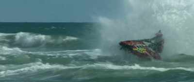 He flies off a wave
and goes by Motzurus, - Hot Water