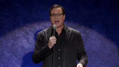 He goes,
[as Ed] "How you doing, Bob?" - Bob Saget: Zero to Sixty