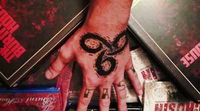 He even got the numbers "666"
tattooed on both his hands, - Demon House