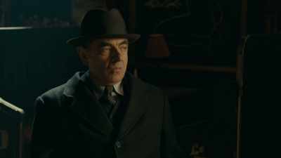 He hangs around out the front
touting for business. - Maigret in Montmartre
