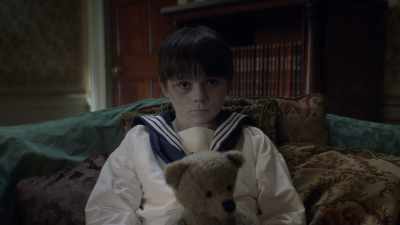 He holds his toy bear
tight for comfort. - Dead Still