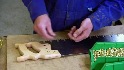 He inserts screws
into the handle, - How It's Made