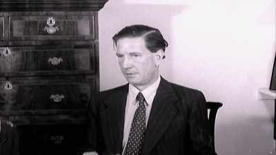 He keeps using his tongue to lick his back teeth. - KGB - The Sword and the Shield