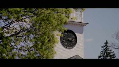 He looks at a steeple
with a clock on it, - Washington