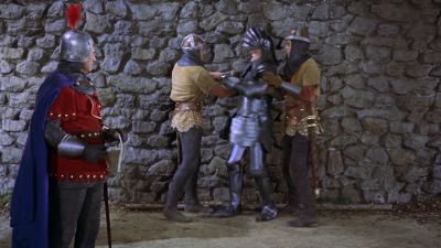 He must scale a stone wall in full armor - The Court Jester