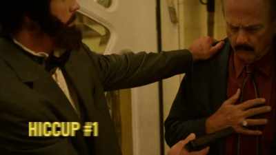 He puts a gun
into the man's stomach... - History's Greatest Heists with Pierce Brosnan