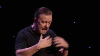 He sat down in his little black suit,
and he was just quiet. - Ricky Gervais: SuperNature